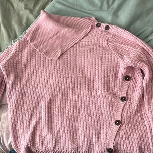 Woman within pink turtleneck sweater